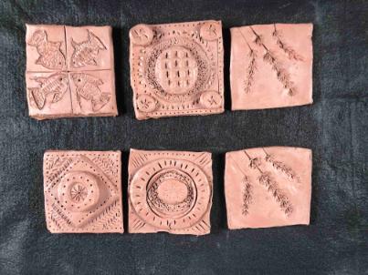 6 decorated clay tiles